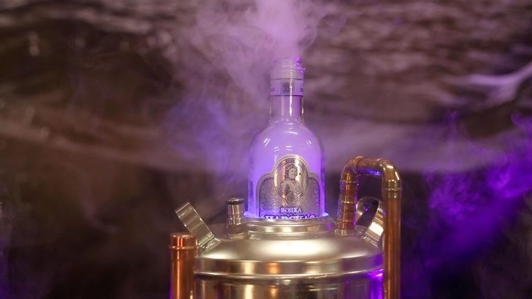 Illuminated vodka bottle chamber producing dense flavour mist