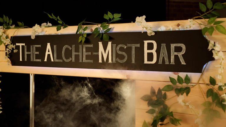 The Alche-Mist Bar illuminated timber sign display with greenery