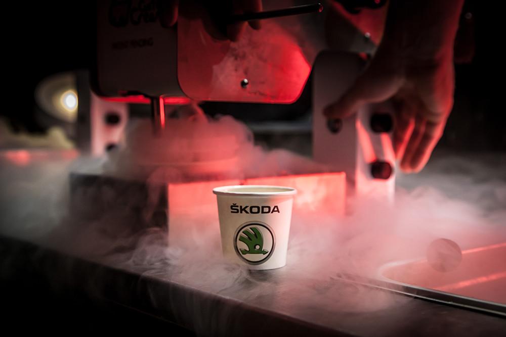 Skoda branded cup surrounded by red-lit liquid nitrogen smoke and sub-zero mixing apparatus