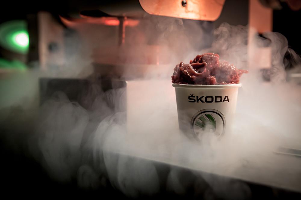 Freshly churned nitrogen ice cream scoop in Skoda cup surrounded by dense white cryogenic cloud