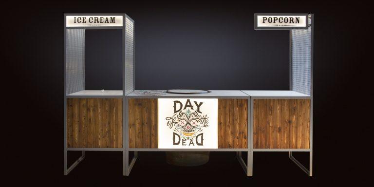 Custom branded modular bar cart setup with illuminated signage for dragon breath popcorn hire