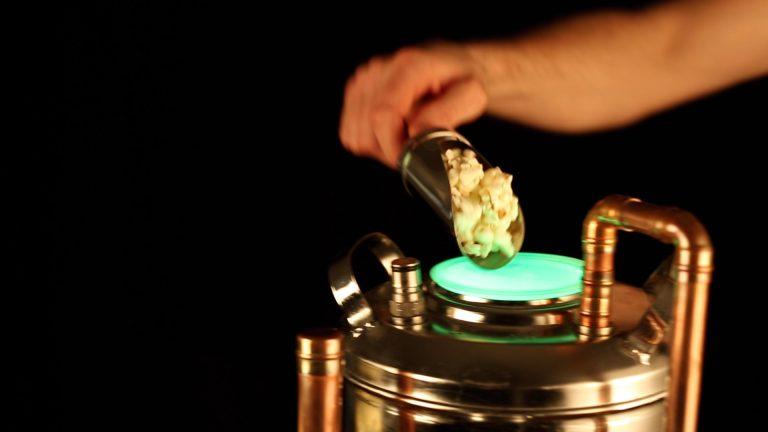 Pouring liquid nitrogen over fresh popcorn for dragon breath effect