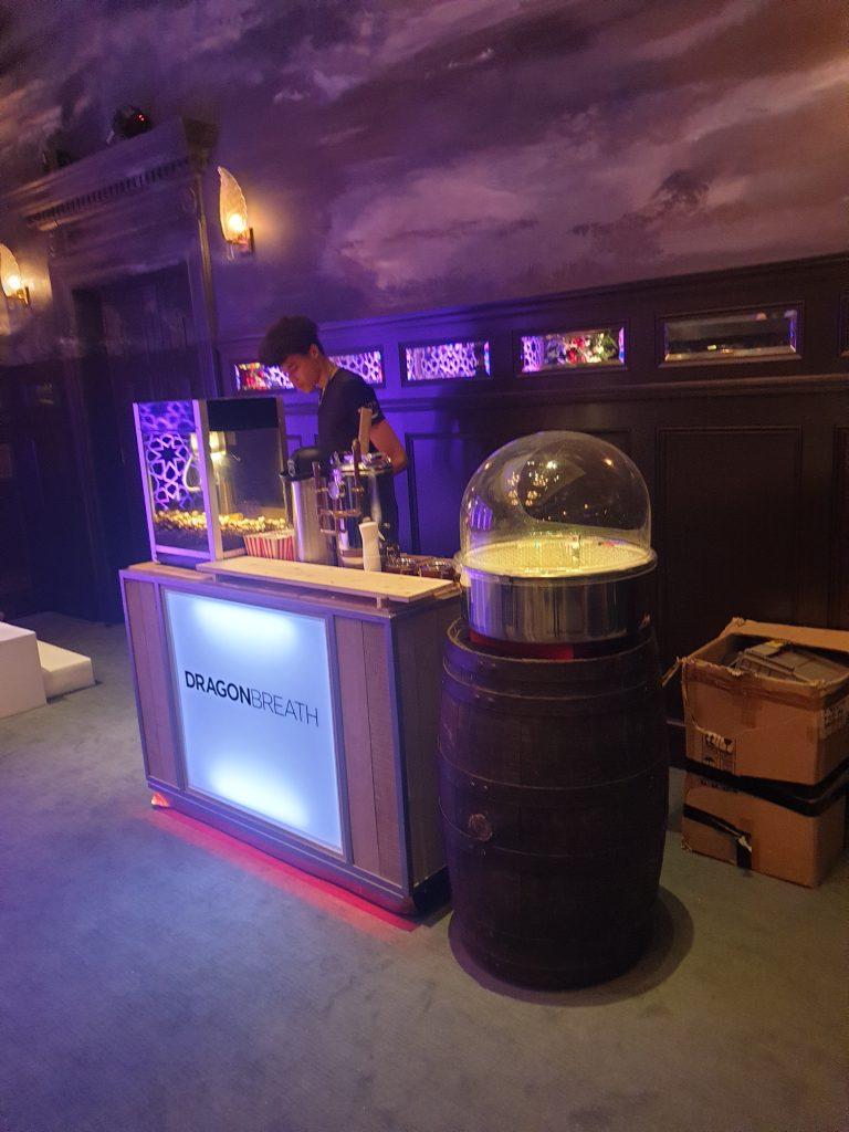 Rustic barrel bar setup for wedding and festival dragon breath popcorn hire
