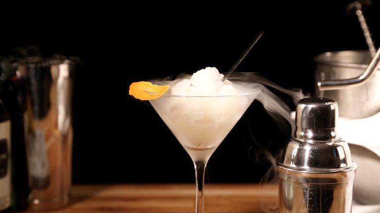 Flash-frozen liquid nitrogen cocktail sorbet garnished with orange peel served in a martini glass