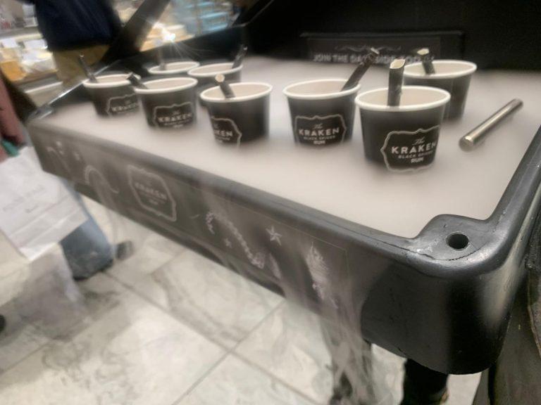 Kraken Black Spiced Rum branded cups lined up in The Misty Tray enveloped in theatrical mist