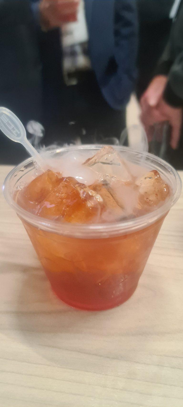 Theatrical liquid nitrogen smoking cocktail served on crushed ice for wedding reception